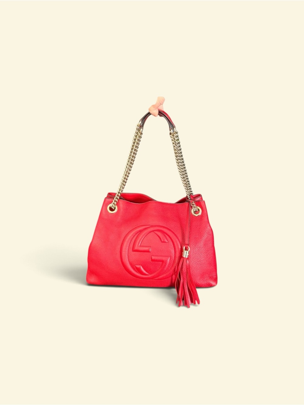 Authentic Gucci Red Leather Shoulder Bag with Tassel and Chain Straps.